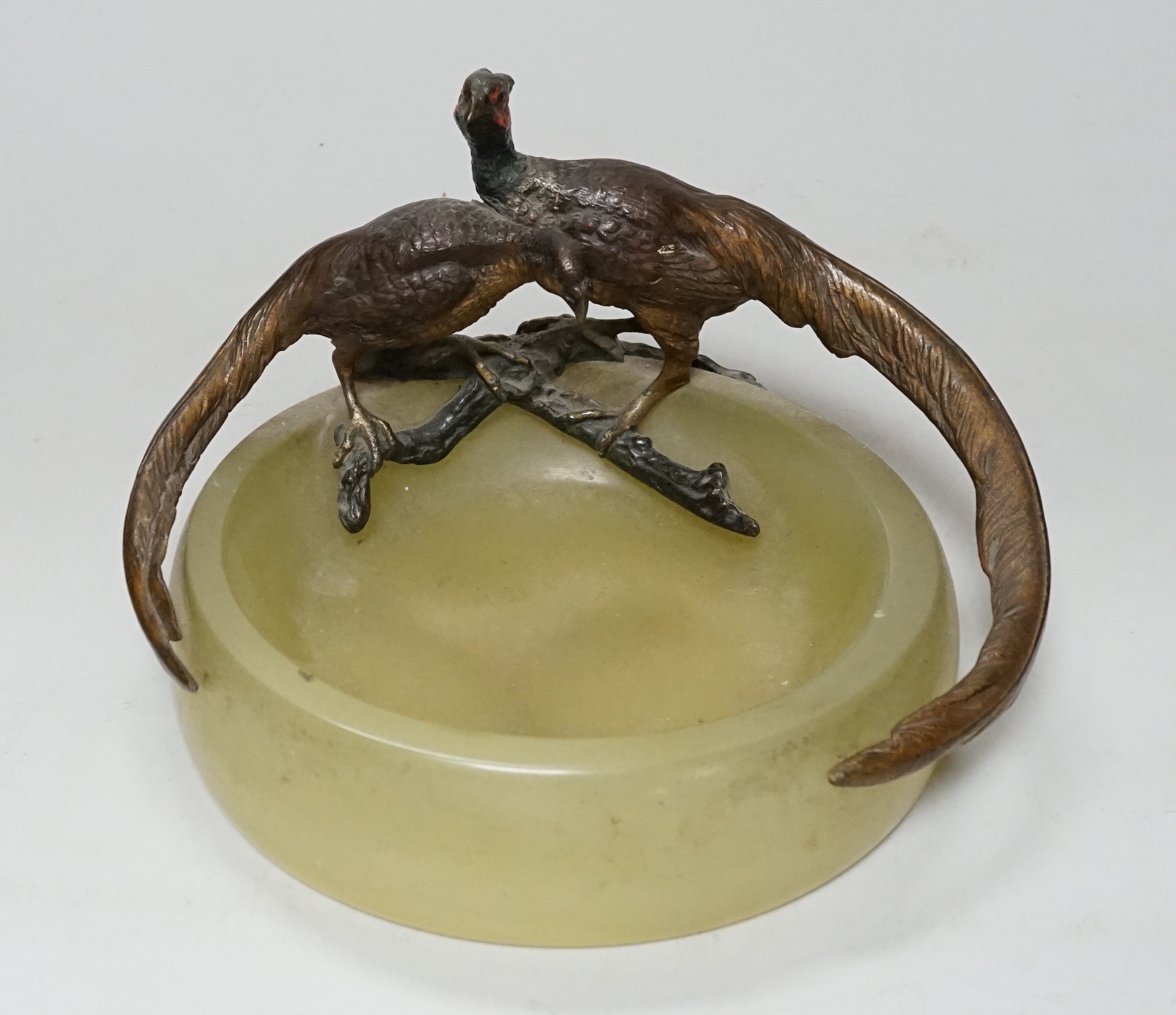 A cold painted bronze ‘pheasant’ mounted onyx ashtray, 17cm wide